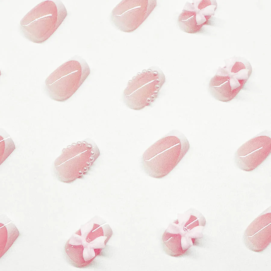 Artificial French manicure nail set with bow decorations and multiple patterns