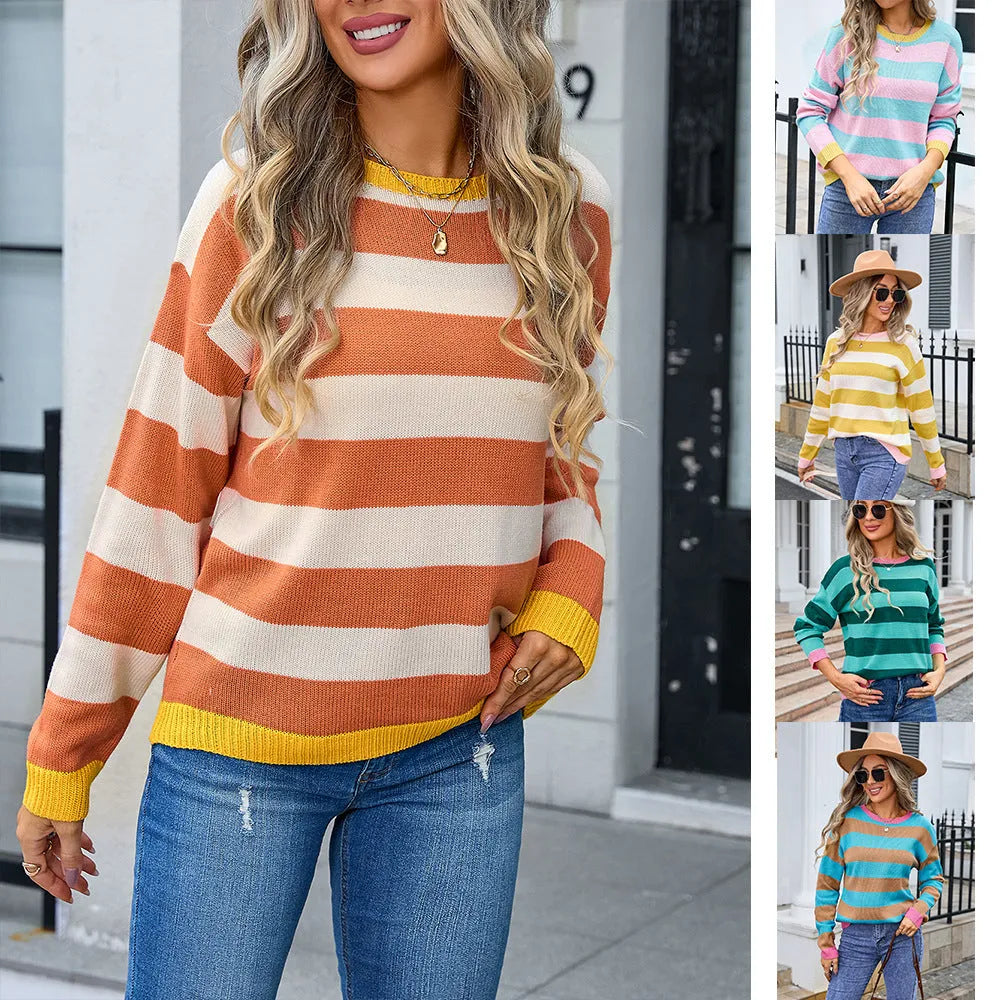 Blue striped women's loose-fit long sleeve acrylic sweater on a hanger.