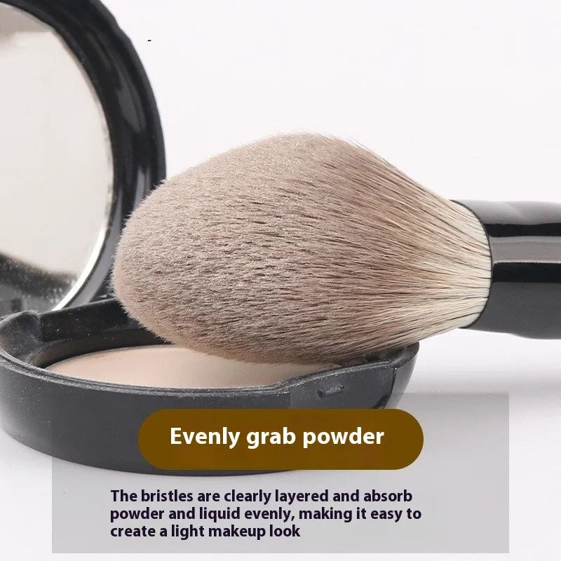 12-piece makeup brush set with wooden handles and a grey PU storage pouch.