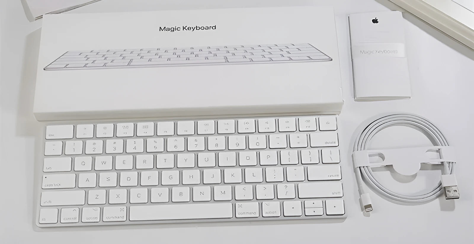 White Apple Bluetooth wireless keyboard with ultra-thin metal construction and multimedia keys