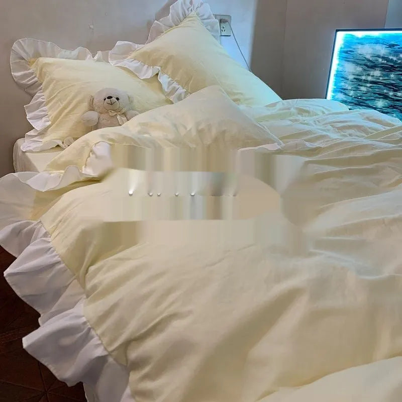 Washed cotton linen bedding four-piece set in solid colour on a bed, showing quilt cover, pillowcases, and fitted sheet.