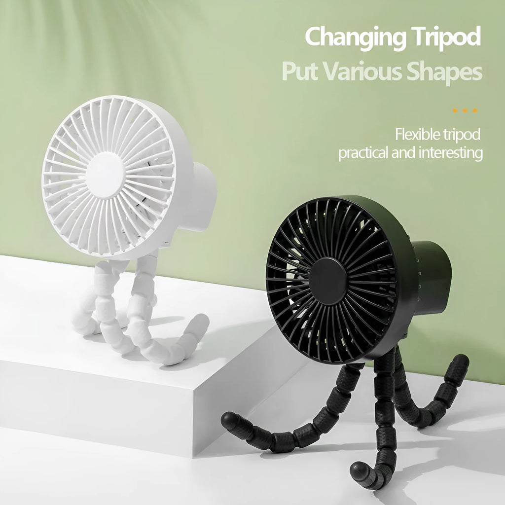 Small adjustable tripod desktop fan with bending head, shown in black on a desk.