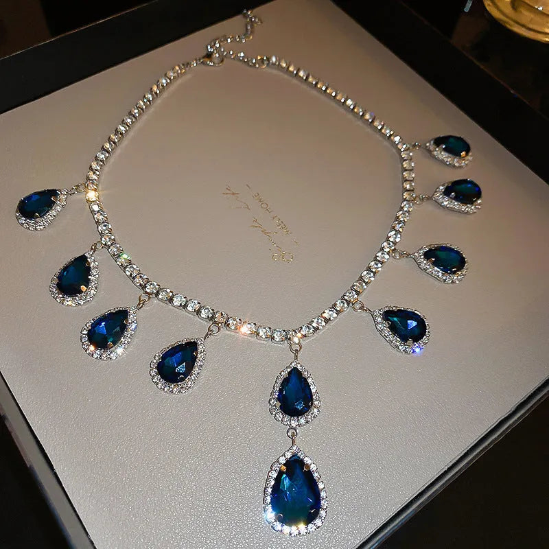 Silver needle water drop earrings and necklace set in blue with zircon pendants and diamond treatment