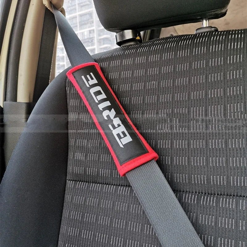 Pair of cotton car safety belt shoulder pads in black blue and red with embroidery