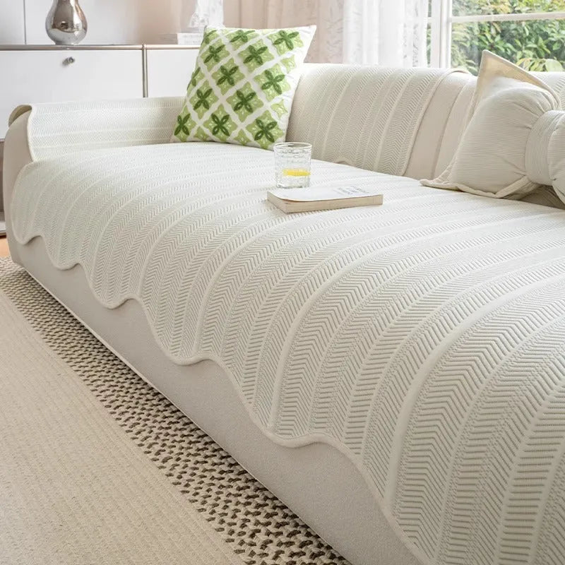 Ice silk fixed non-slip sofa cover in a special pattern, shown in jelly green colour on a couch.