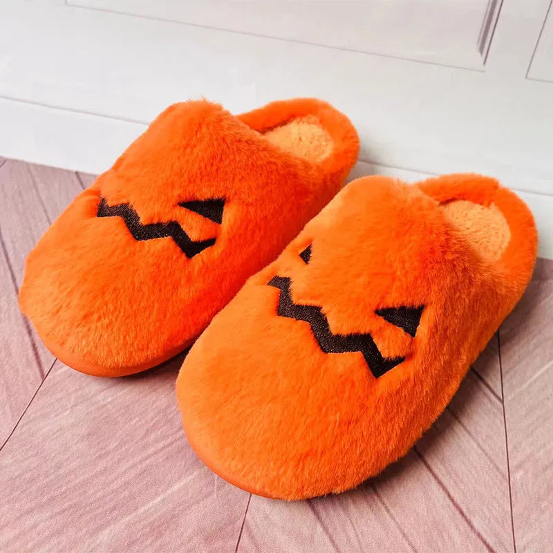 Orange Halloween pumpkin slippers with coral velvet upper and plush lining for indoor winter wear