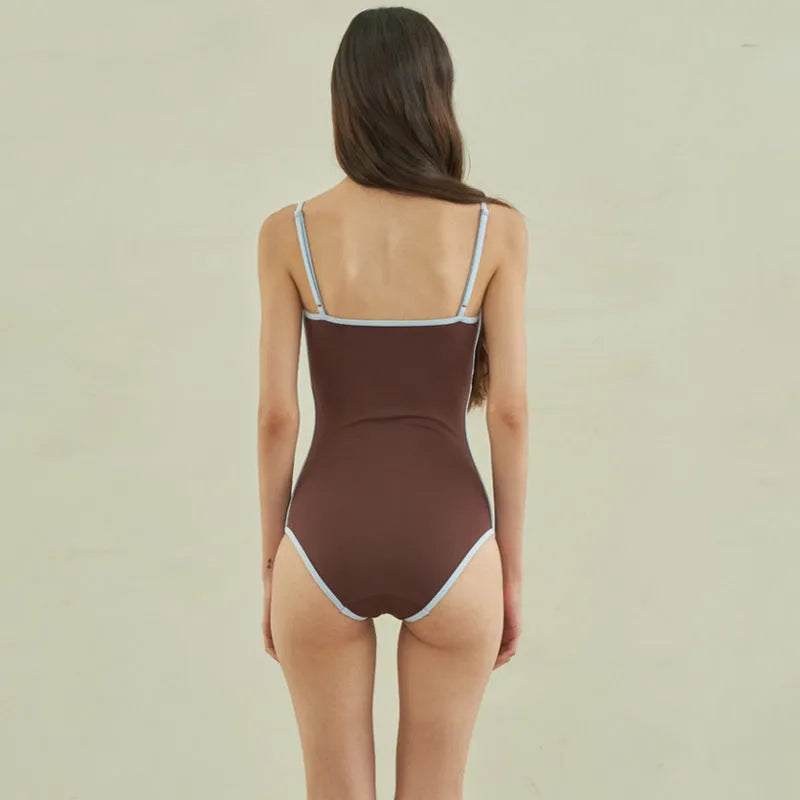 Brown women's one-piece swimsuit with triangle top design