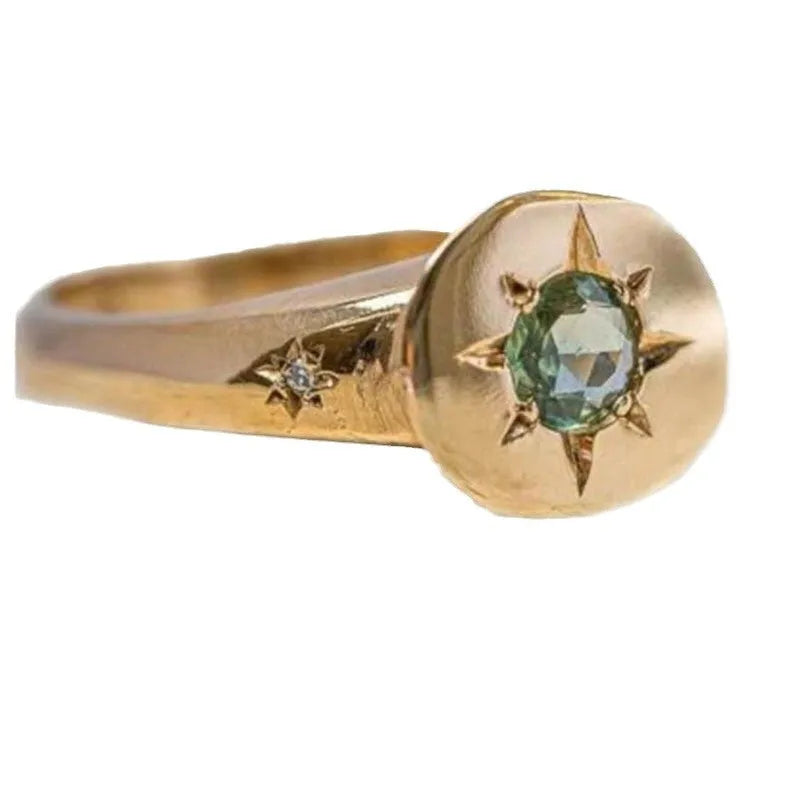 Golden adjustable ring with star design and oval asterism zircon setting