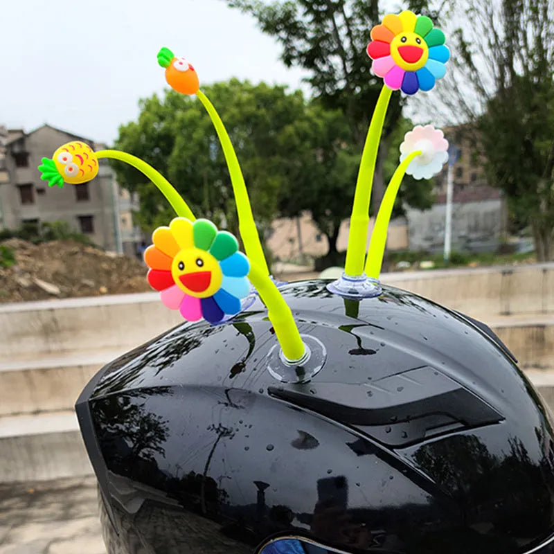 Yellow silicone sunflower decoration with suction cup for helmet customisation.