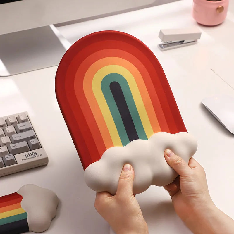 Silicone gel wrister mouse pad and keyboard support set with white cloud pattern on a desk.
