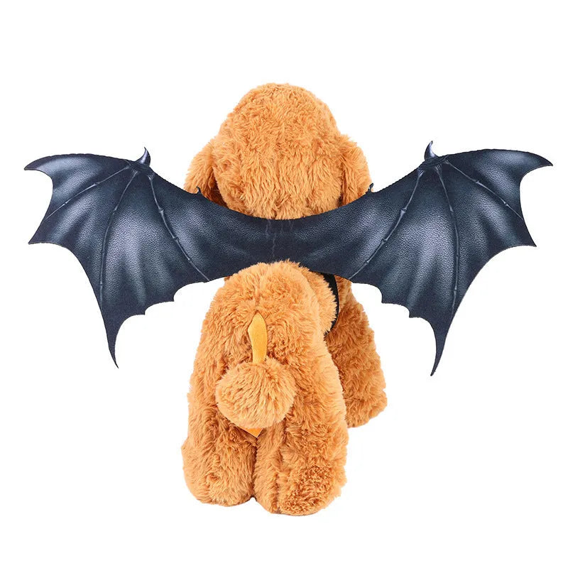 Black cloth bat wing costume for a cat or dog, showing large wing span.