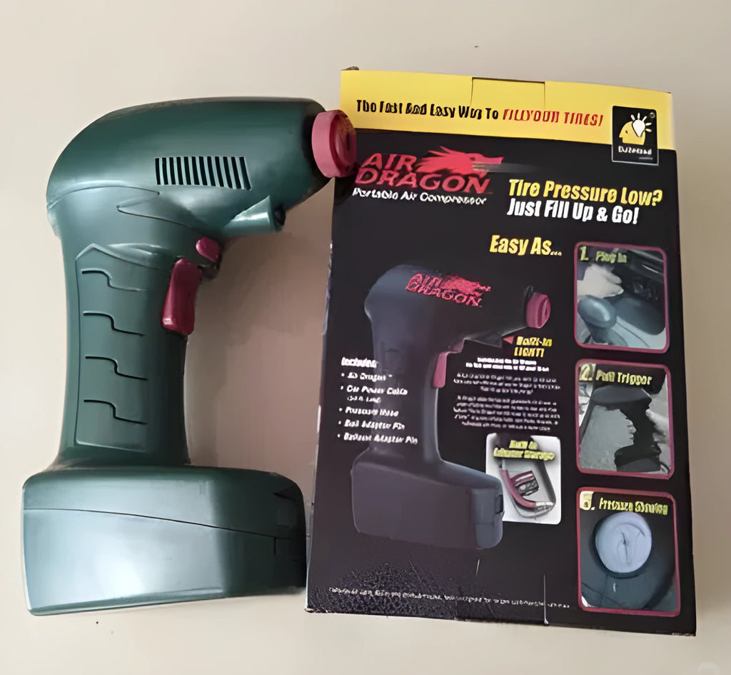 Portable 12V car tyre electric pump with digital gauge and hose on a grey background.