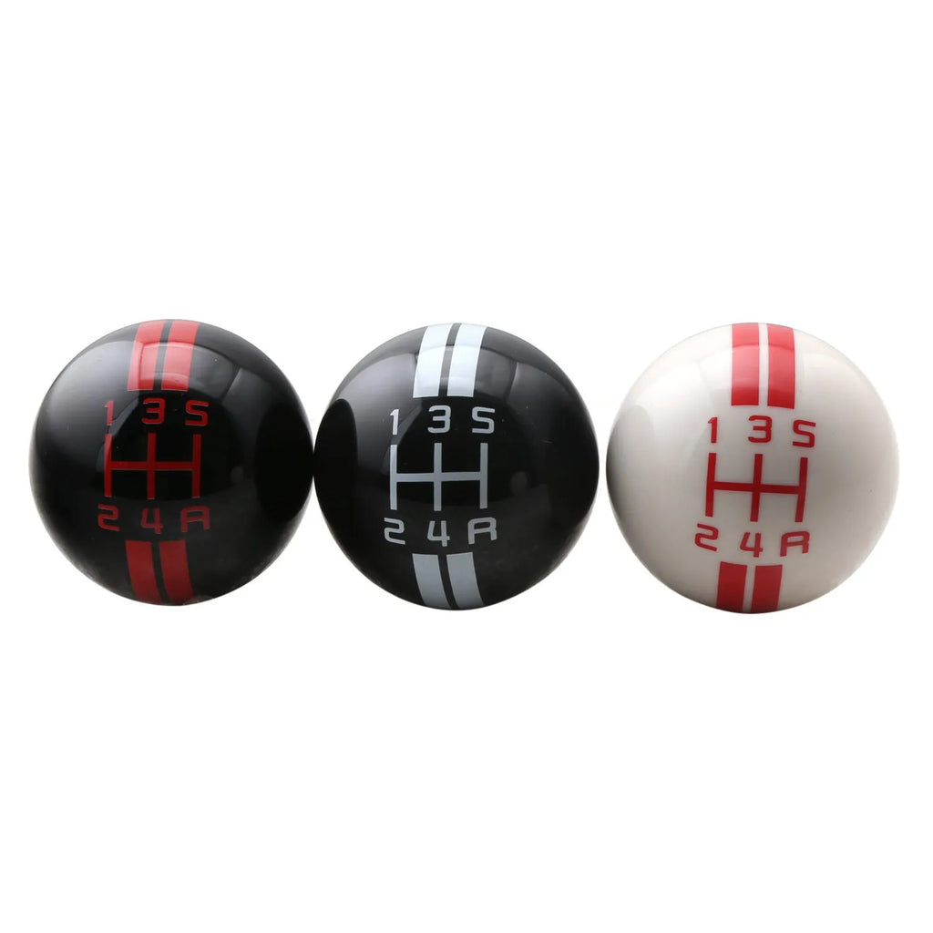 Black acrylic car gear knob for 5-speed manual, showing red lettering marking the gear positions.