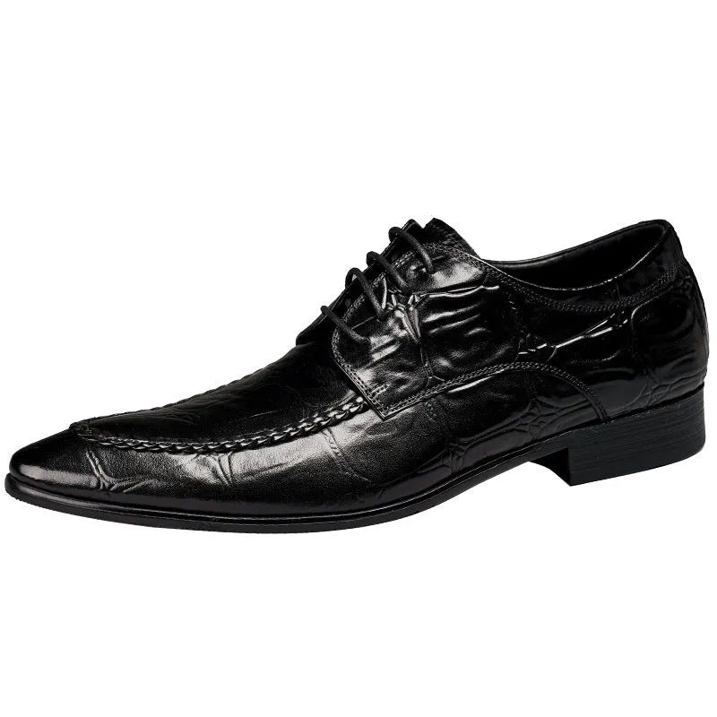 Men's black leather formal shoes with alligator pattern texture and a horse bit buckle detail.