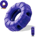 Blue tyre-shaped dog chew toy with oval openings for treat dispensing