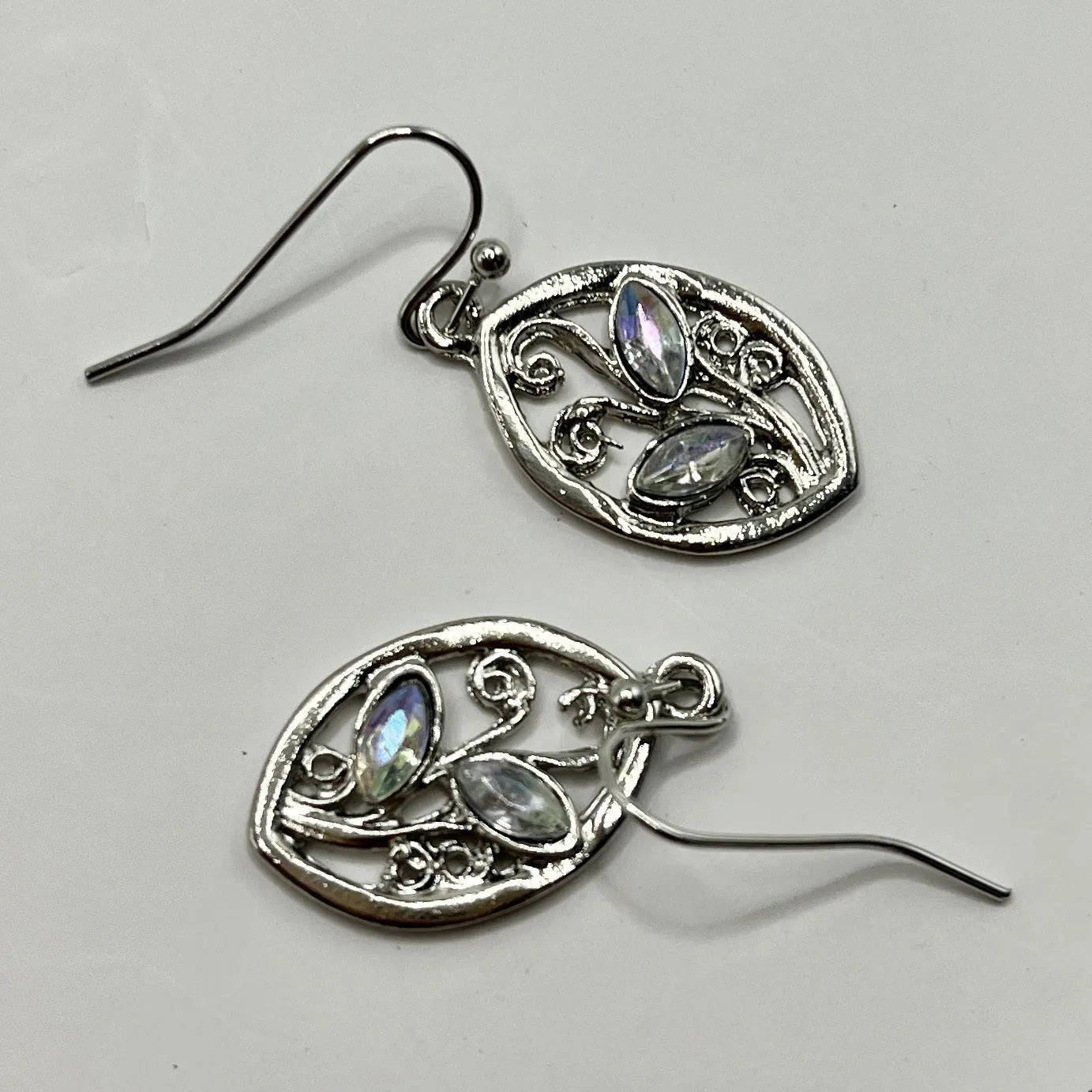 Silver colour women's earrings with leaves design and embedded colourful moonstones