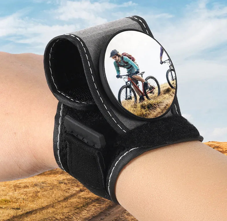 Black nylon bicycle wrist-mounted rear-view mirror for cycling safety.