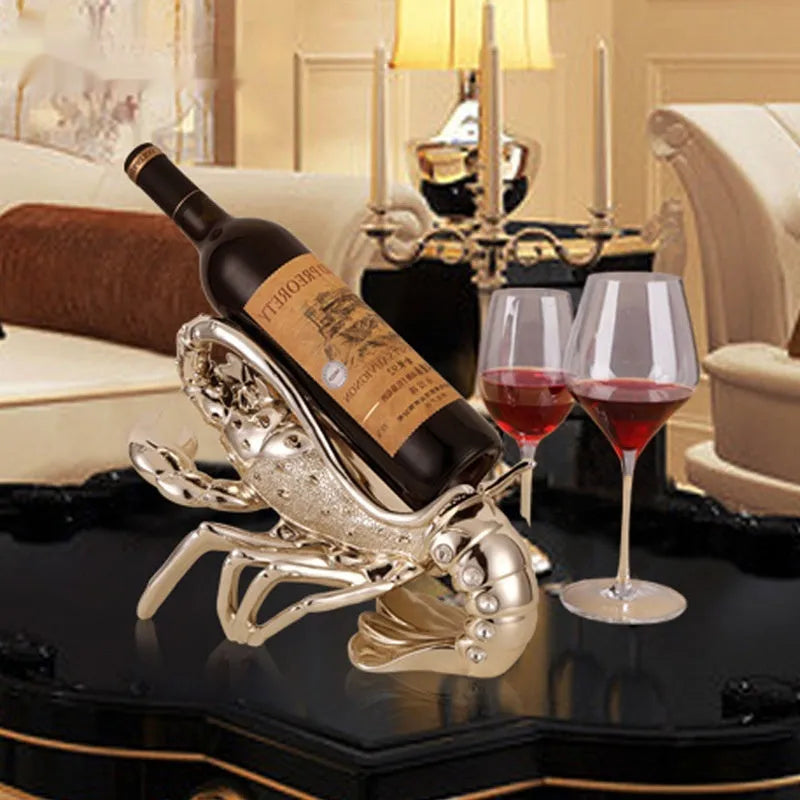 Lobster-shaped wine rack ornament in rose gold or silver metallic finish on tabletop