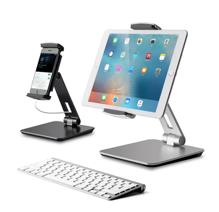 Silver folding aluminium phone and tablet stand with 360-degree rotation on desktop