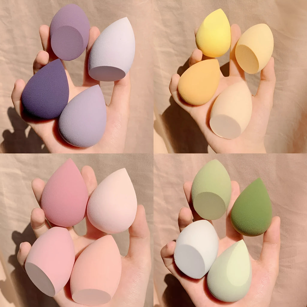 Makeup egg box open showing four coloured synthetic sponge beauty eggs in grape, mango, mint and peach peach.