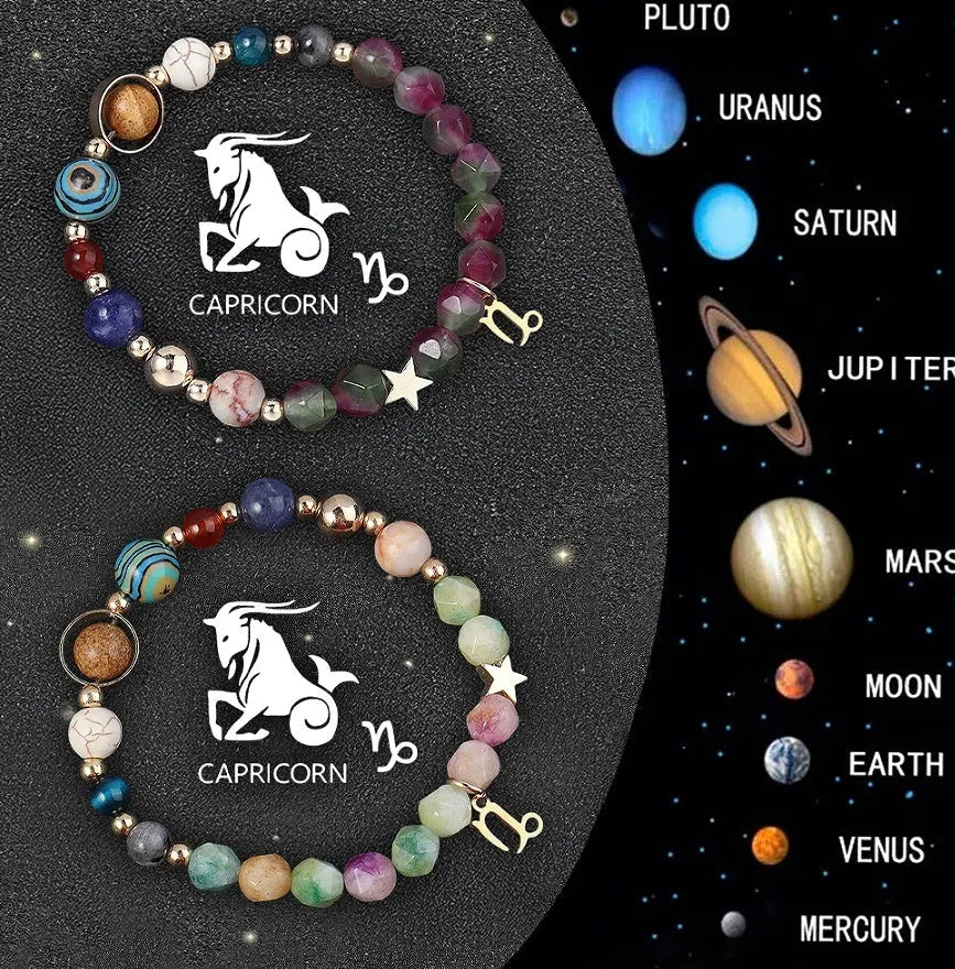 Two natural stone beaded bracelets with carved zodiac animal designs on a wooden surface.