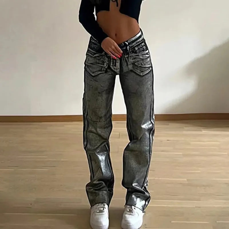 Washed blue high-waist straight-leg jeans with hot silver contrast stitching on a mannequin