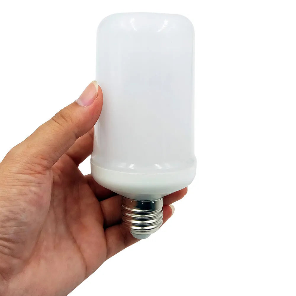 Close-up of a flame effect LED light bulb emitting a warm, flickering orange glow.