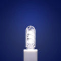 Small white USB LED night light showing warm and white light colour options