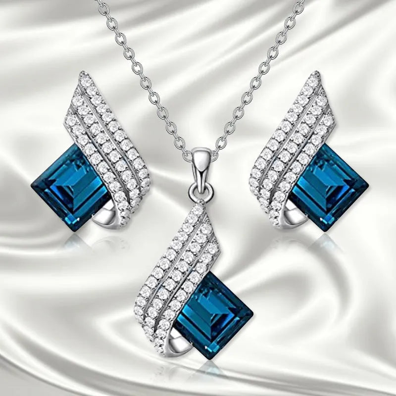 Glass pendant and alloy cross chain necklace with matching electroplated ear studs jewellery set in two style colours.