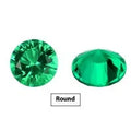 Selection of cultivated Columbia green emerald gemstones in various shapes and sizes on a white background.