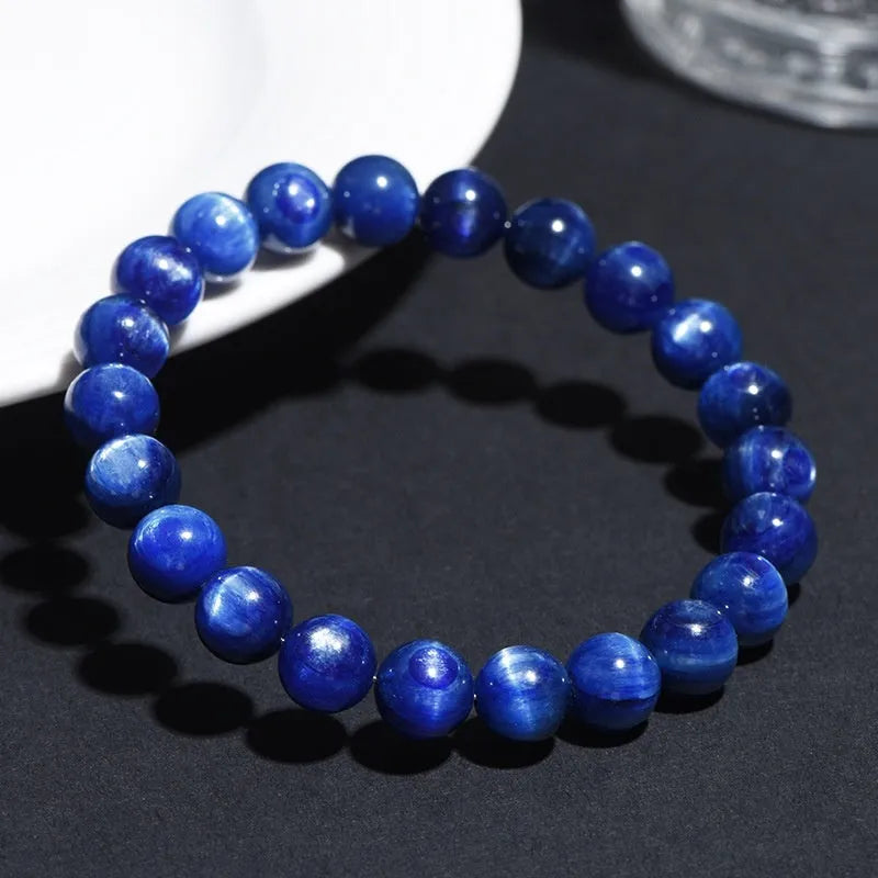 Blue crystal ball bracelet with geometric shape and Ruyi design elements on polished natural crystal