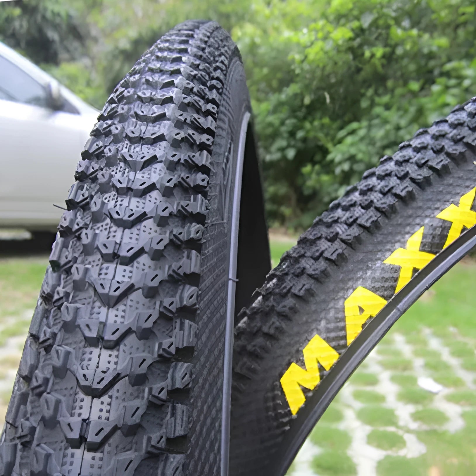 Ultralight puncture-resistant mountain bike tyre showing tread pattern, available in multiple wheel sizes.