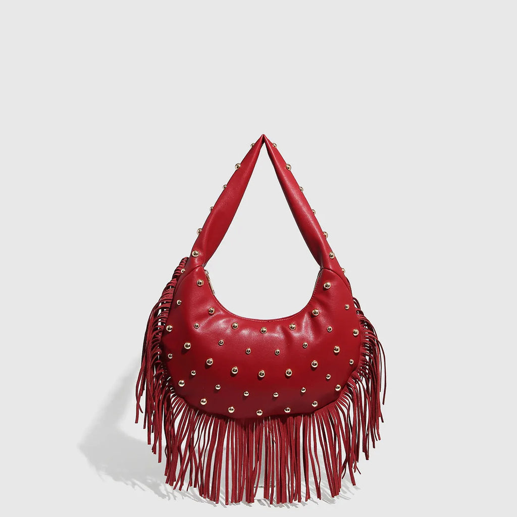 Retro black shoulder handbag with long tassel fringe and internal mobile phone compartment.