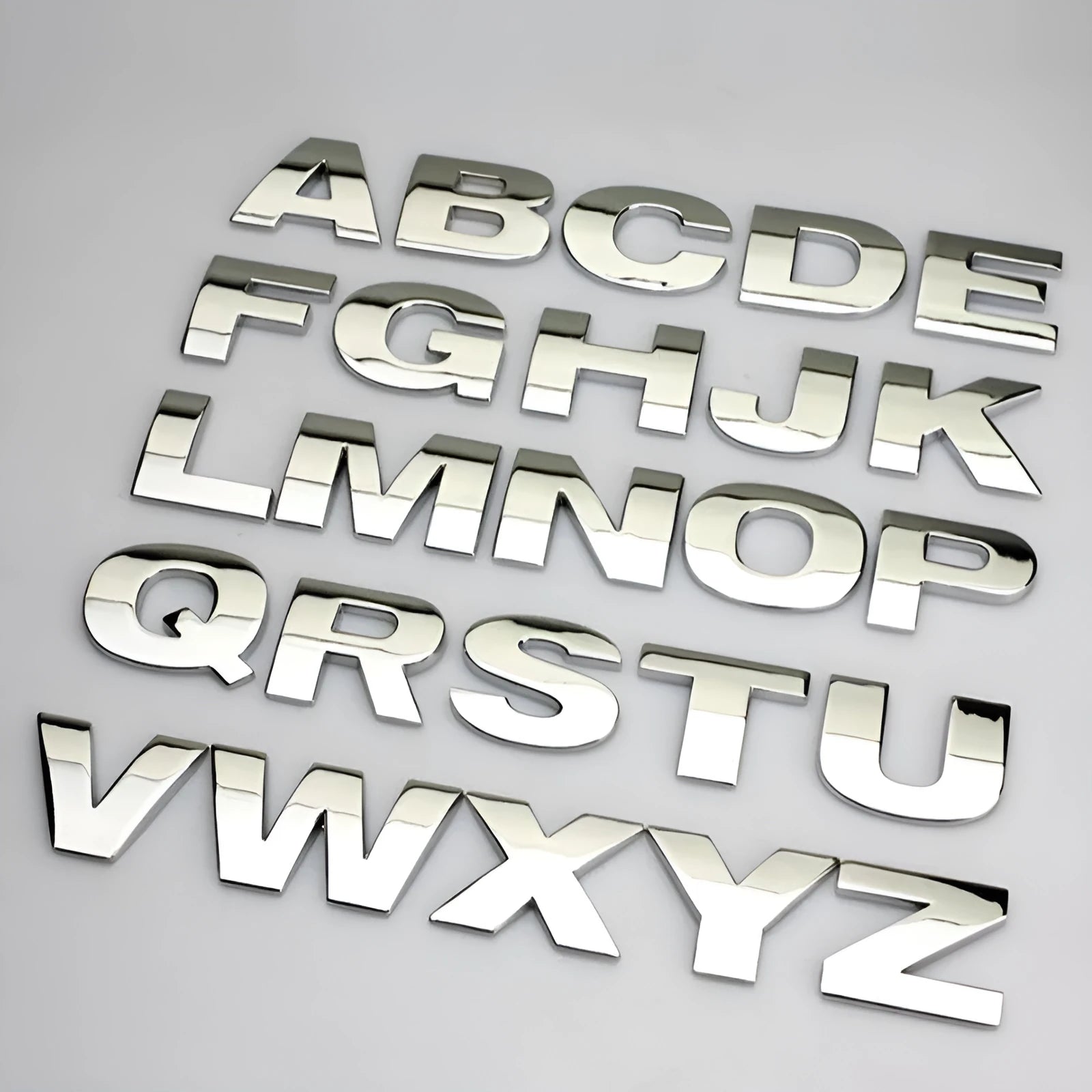 3D metal car letter sticker in zinc alloy showing raised black letter on silver background