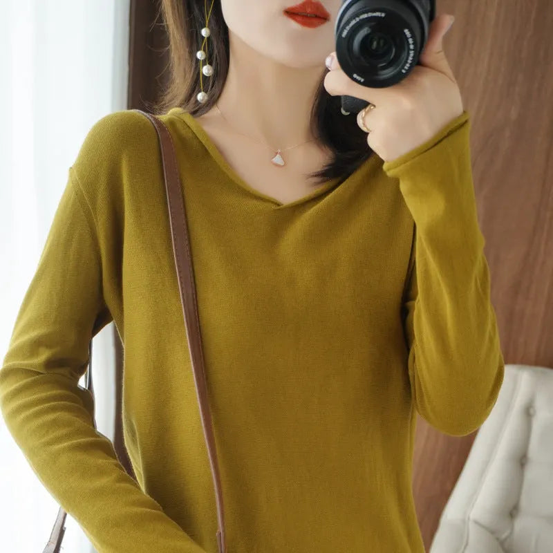 Women's V-neck long sleeve knit pullover top in a macaron colour on a hanger.