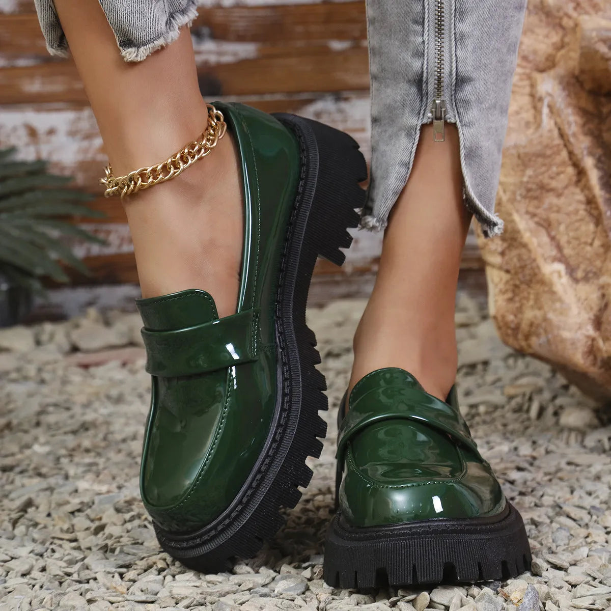 Plus size women's black chunky heel loafers with a slip-on mid-top design and rubber sole.