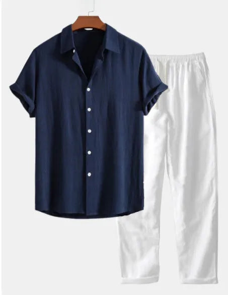 Man wearing a casual navy blue short sleeve shirt and matching shorts cotton linen beachwear suit set.