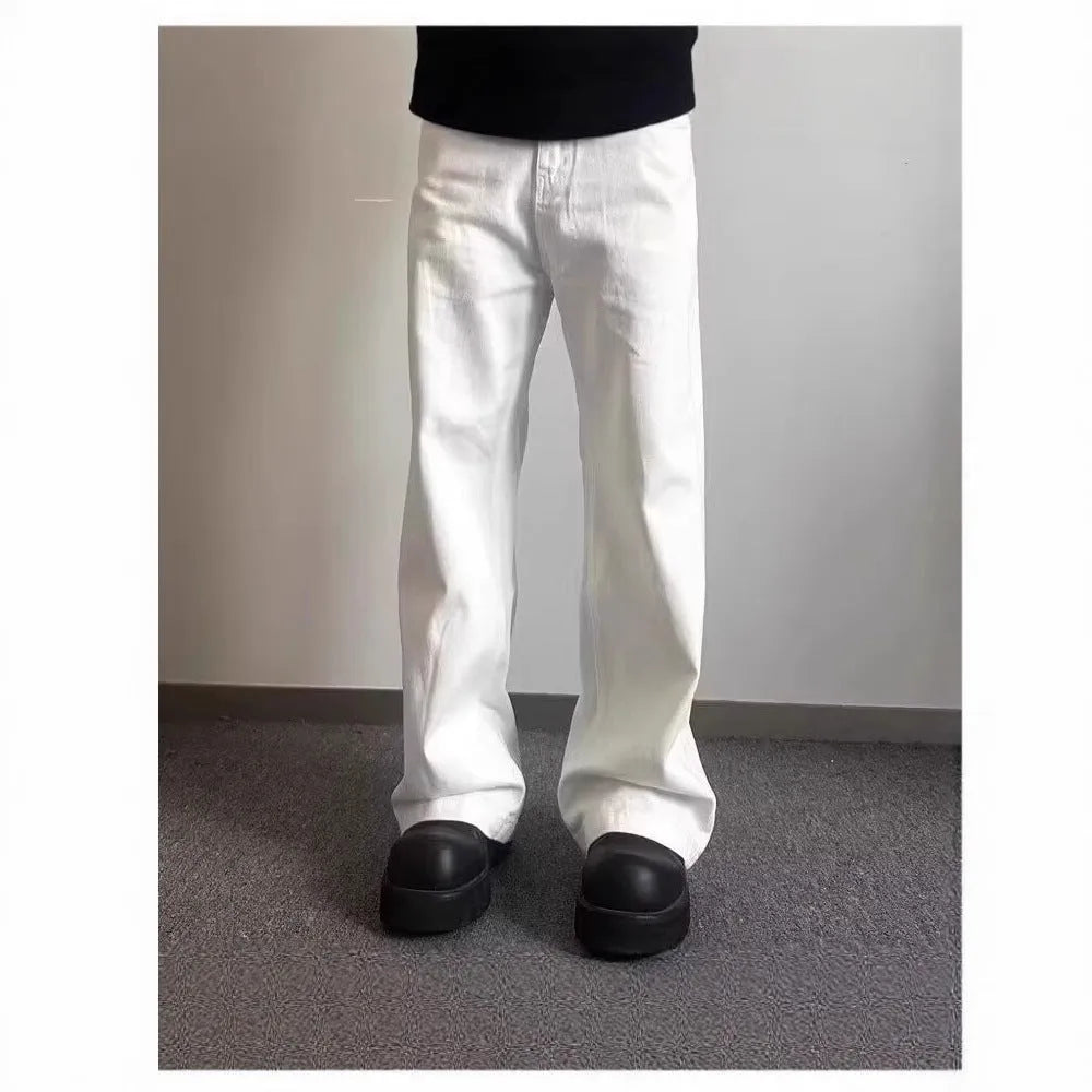 Men's white straight-leg denim jeans with wide leg opening and zip fly
