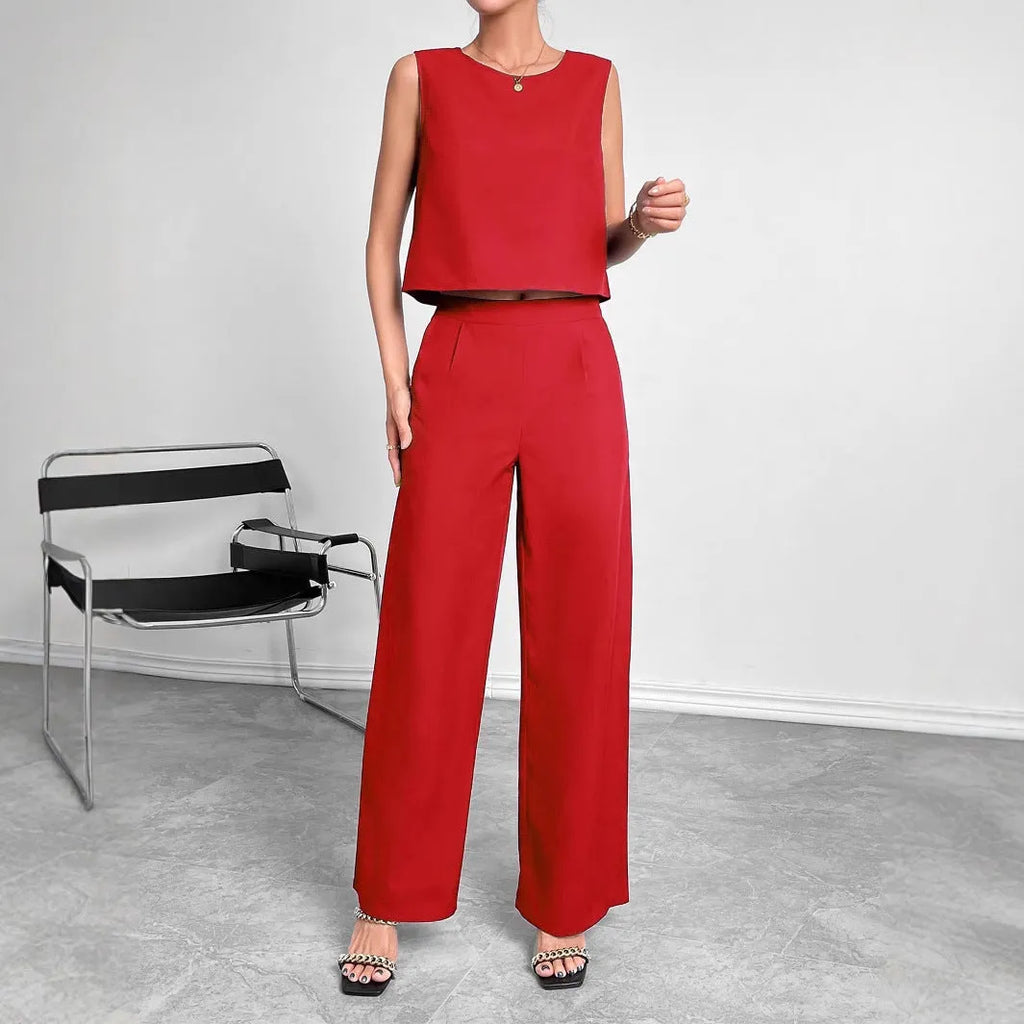 Red women's sleeveless top and wide leg trousers two-piece co-ord set on a hanger