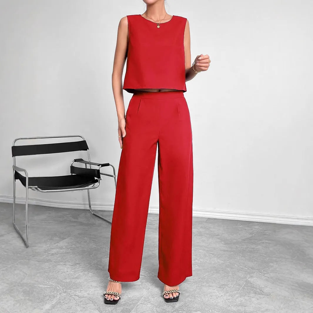 Red women's sleeveless top and wide leg trousers two-piece co-ord set on a hanger