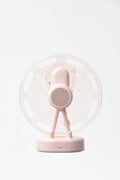 Pink Ferris wheel Bluetooth speaker projecting colourful water ripple light patterns on a surface.