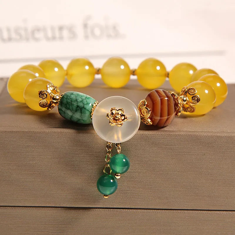 Women's yellow agate and crystal adjustable wrap bracelet on gold silk thread in khaki.