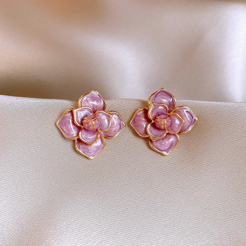 Purple flower stud earrings with gold plating and oil-spot glaze finish on copper construction