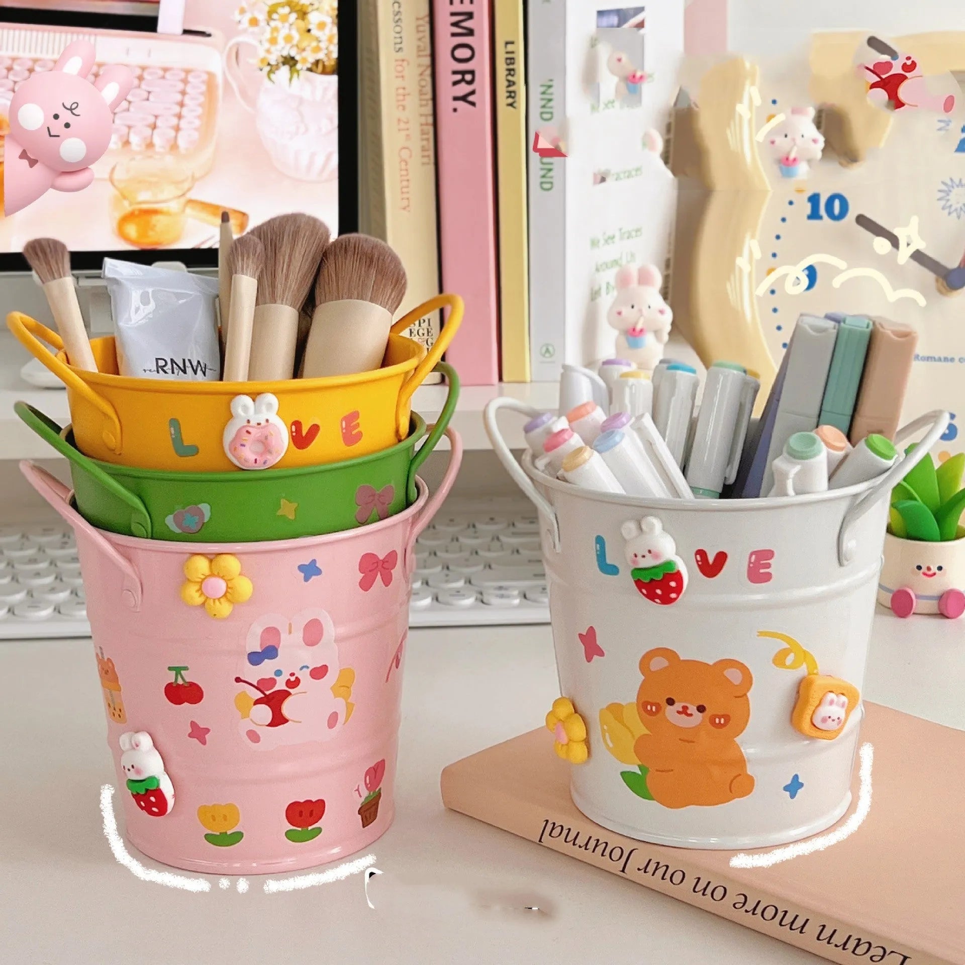 Round metal pen holder in choice of colours with optional decorative sticker patches on a desk.