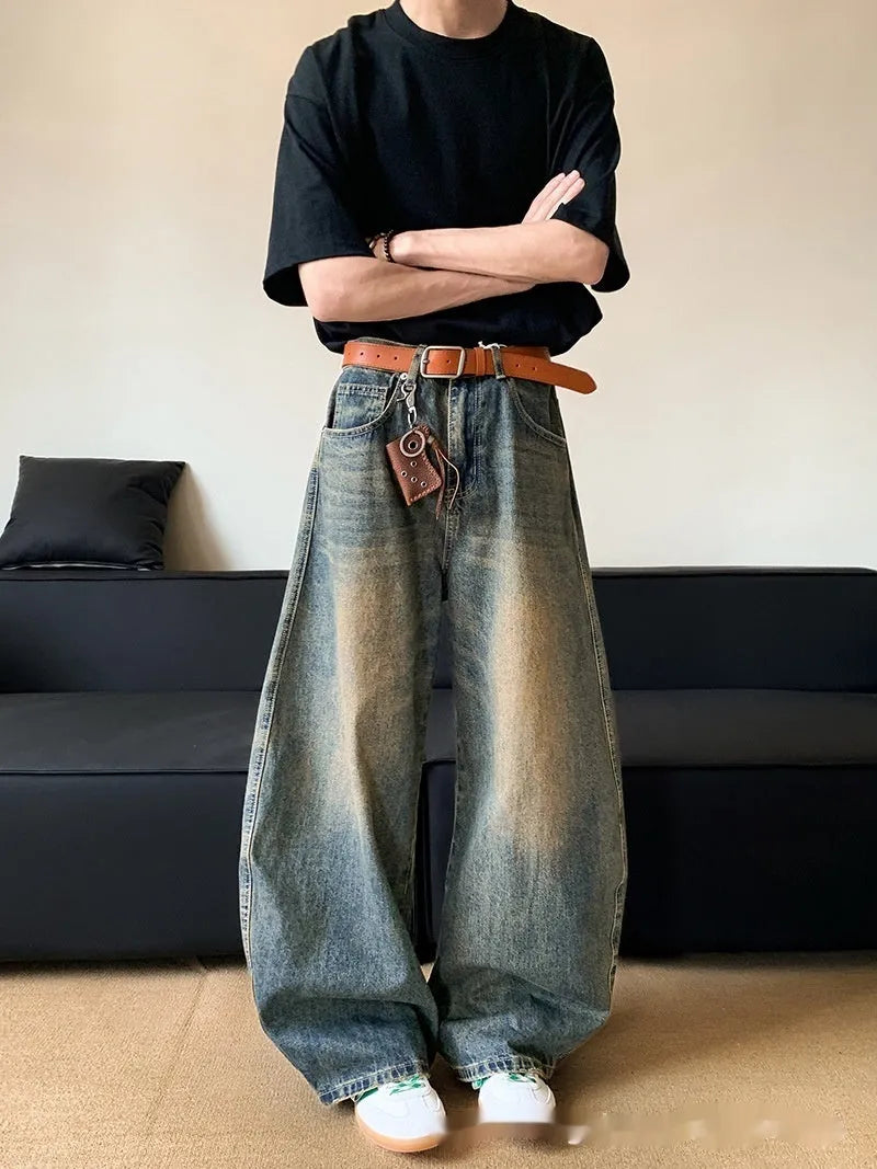 Men's retro blue distressed denim jeans with slim wide-leg fit showing micro elasticity fabric