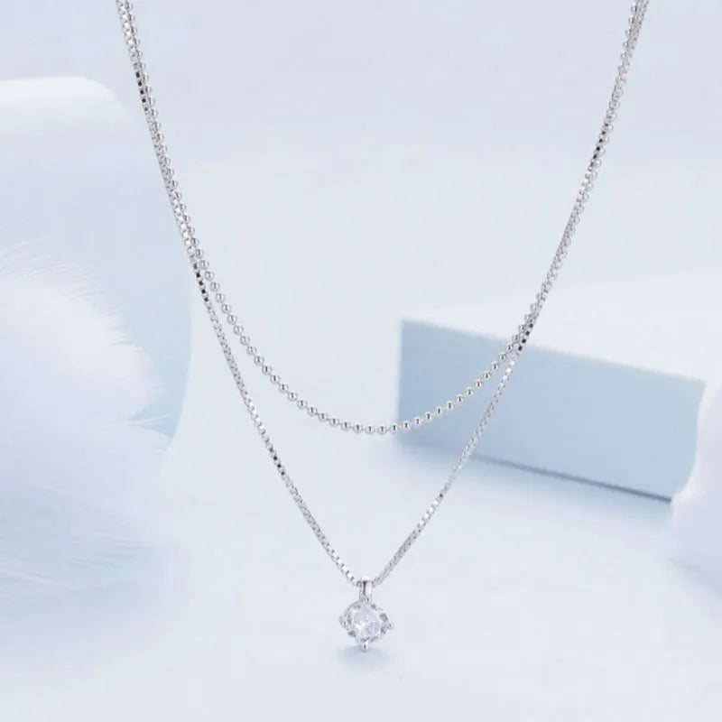 Women's double-layer sterling silver necklace with pearl chain detail in polished silver colour