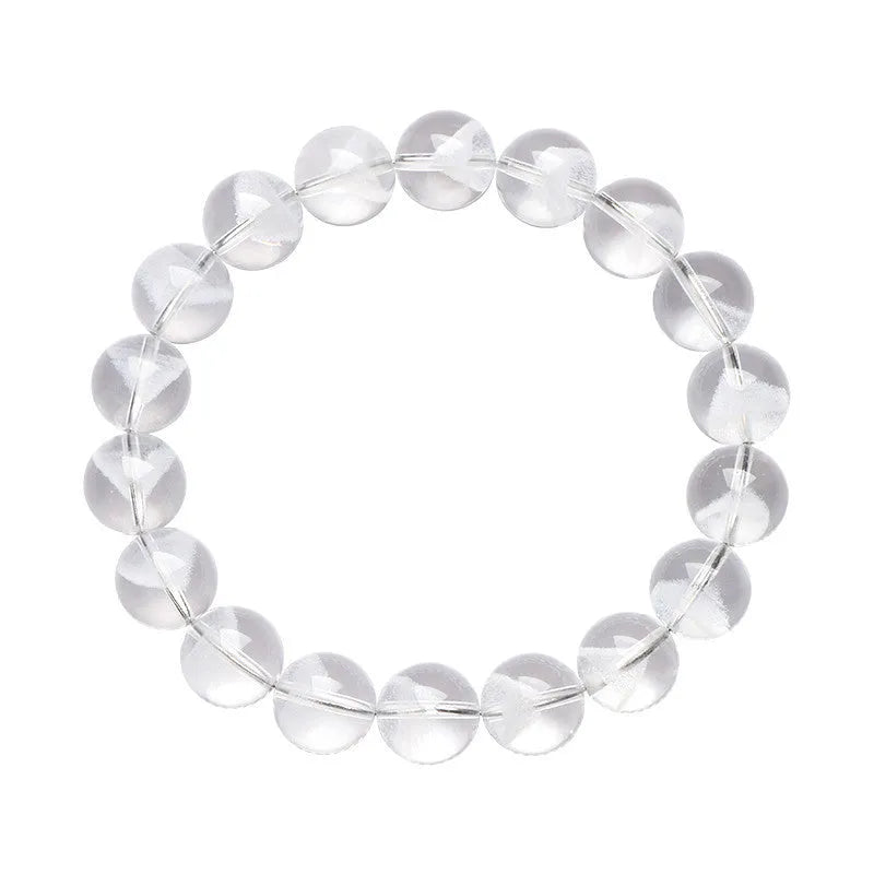 Women's white crystal ghost pyramid bracelet with ruyi charm on a wrist, showing bead detail.