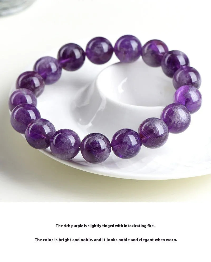 Natural feather amethyst crystal bracelet in snow mountain purple with scattered beads and ruyi geometry.
