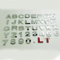 3D metal car letter sticker in zinc alloy showing raised black letter on silver background