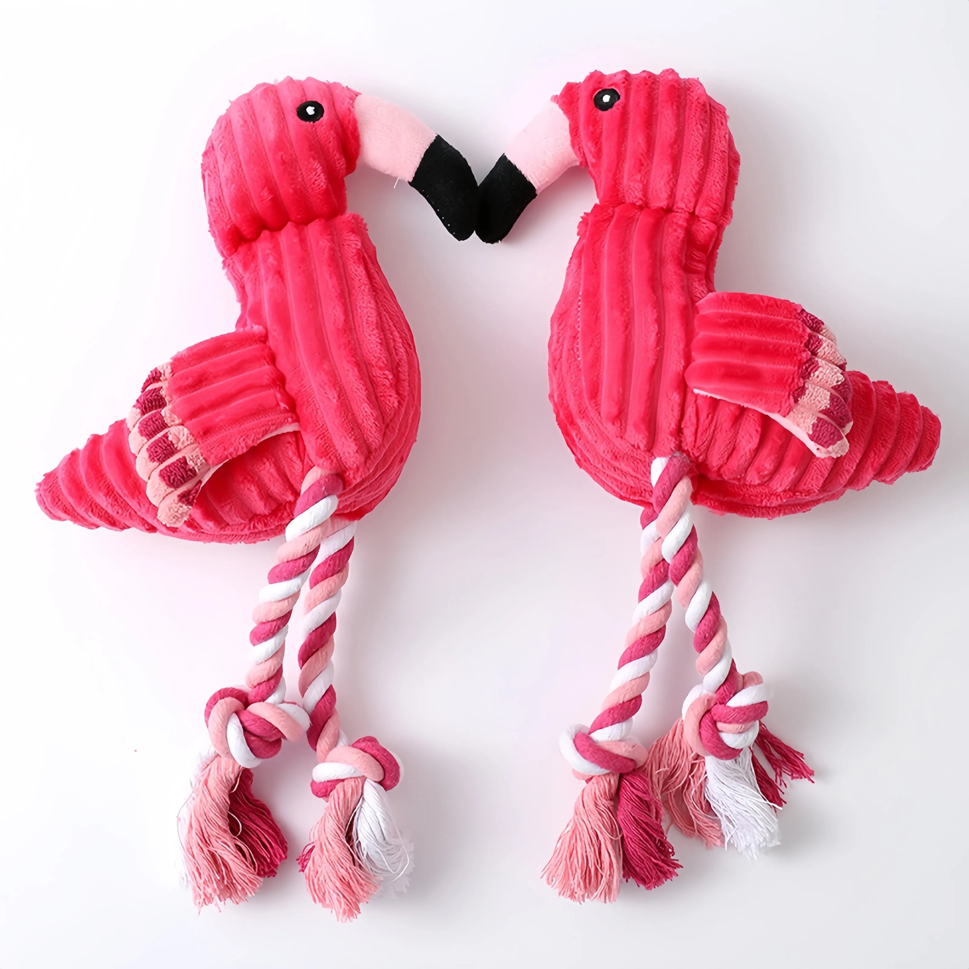 Pink animal-shaped corduroy squeaky dog toy with reinforced stitching